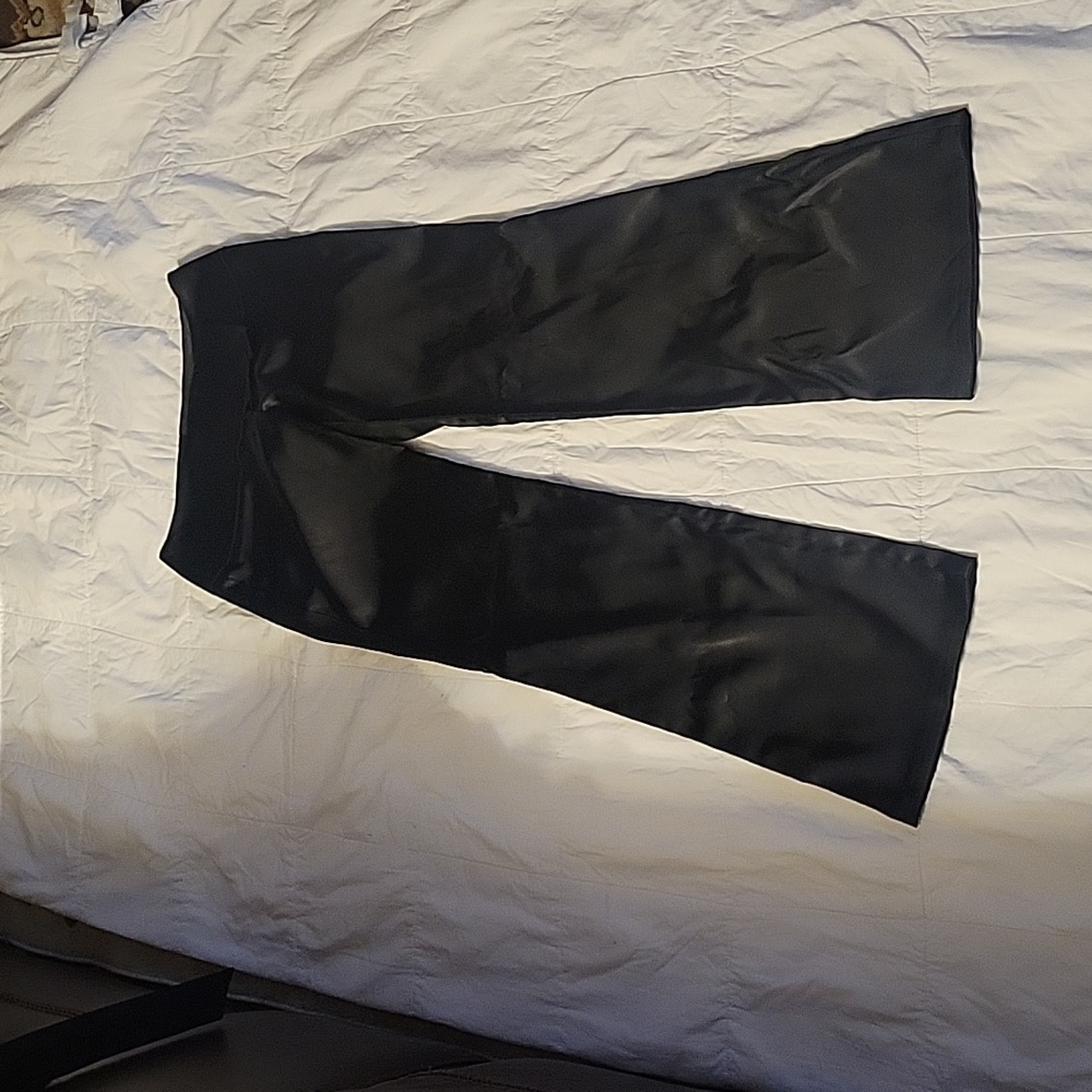 Women's/ juniors black satin pants.  Zip and wide band waist. Size 0.